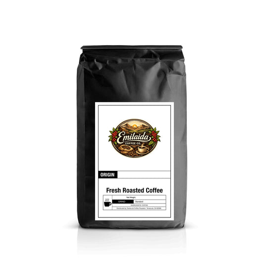 Black coffee bag with 'Emilaida Coffee Co.' label on a white background